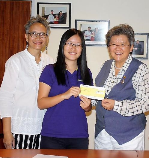 Receiving her first cheque (2)